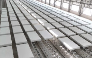 A neatly arranged storage area of finished Oriental Crystalline Silicon panels, reflecting the company’s high production capacity and efficient logistics.